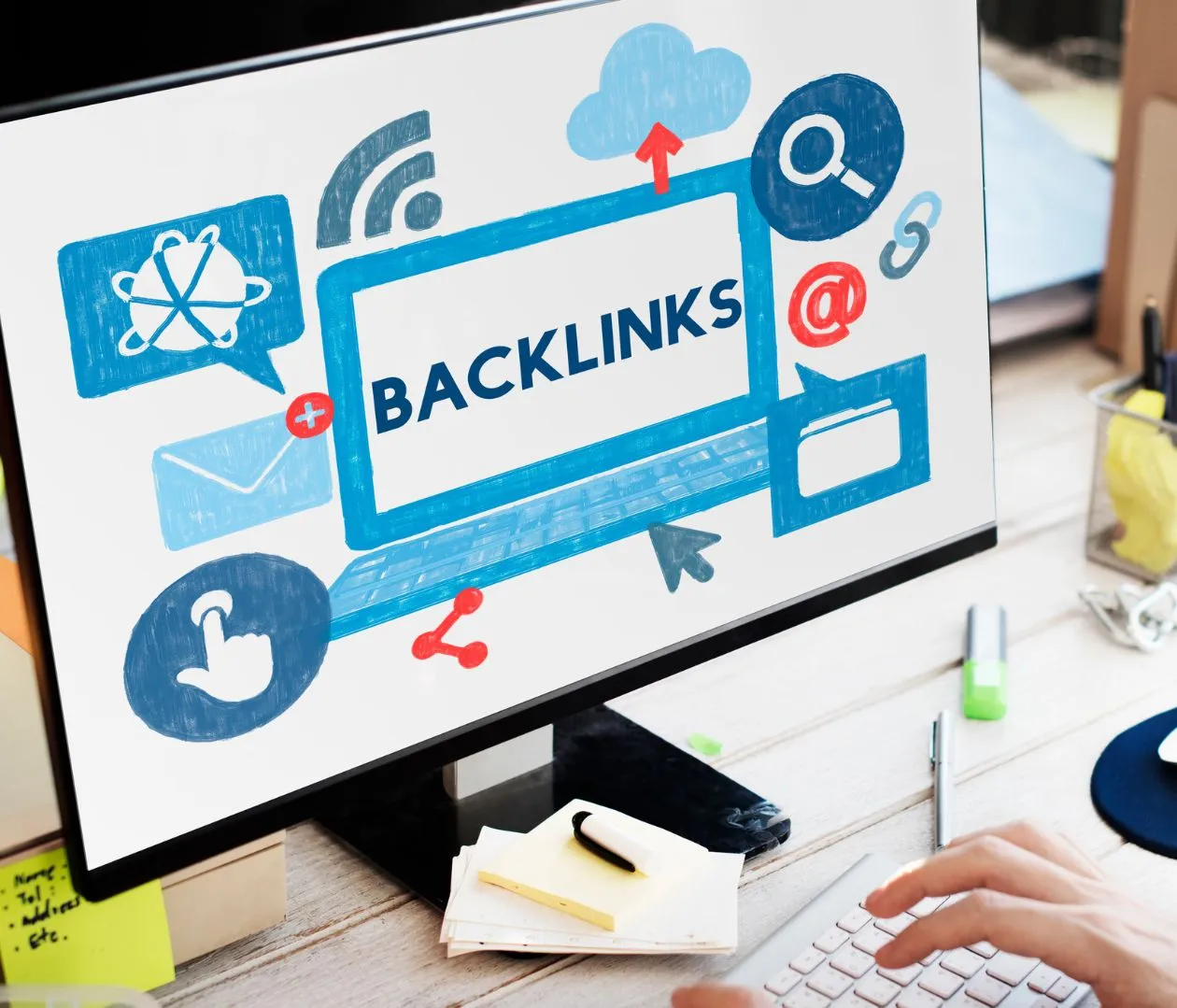 Computer monitor displaying the word "Backlinks" with various icons like email, cloud, and search, representing the concept of generating high-quality backlinks for enhancing SEO for real estate agents.