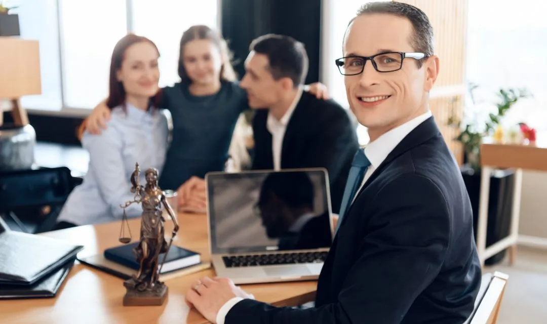 Smiling family lawyer at a desk with a laptop, a statue of Lady Justice, and a happy family in the background, illustrating a family law firm's effective SEO strategy to increase online visibility, traffic, and client inquiries through local SEO and targeted content.