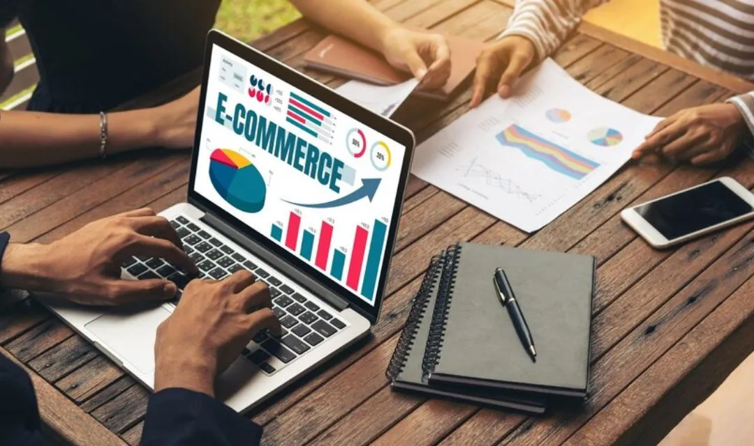 Close-up of a person working on a laptop displaying e-commerce data with charts and graphs, representing a successful SEO strategy that increased conversion rates by 35% for a New York real estate agency through targeted keywords and optimized website design.