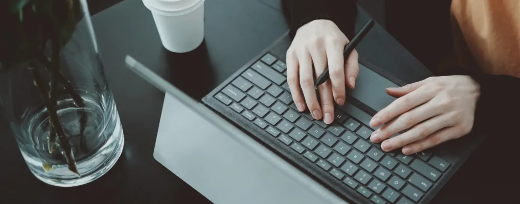 Illustration of a person holding a magnifying glass next to a computer screen displaying "SEO," with icons representing settings, communication, and targets. The text reads "How to do Technical SEO for E-commerce Websites" with a call-to-action to subscribe, highlighting key technical SEO strategies for online retailers.